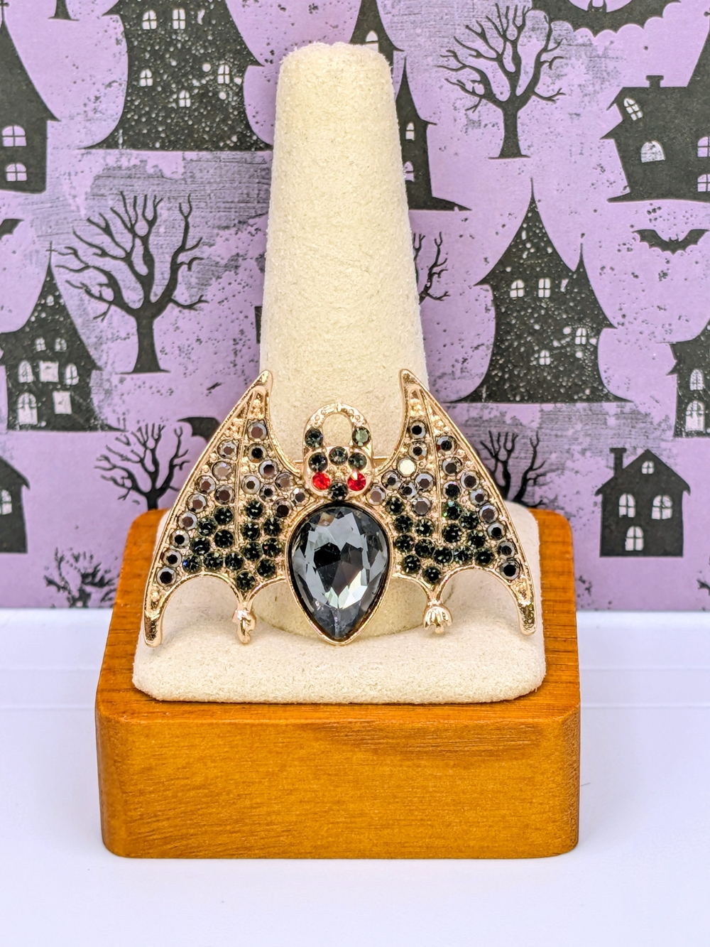 Gold Tone Metal Bat Brooch with Black And Red Rhinestones